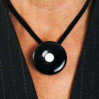 Onyx Mourning Button with a button of a loved one is worn as a pendant on a black velvet band. With loose extension chain. L= 44-65 cm.