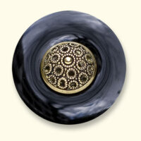 An onyx Mourning Button with a button of a loved one on it. The black onyx is always evenly coloured.